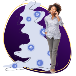 Lady on phone next to map